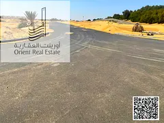 Land for sale in Al Zahia, Ajman, on a street and alley, suitable for residential or investment purp