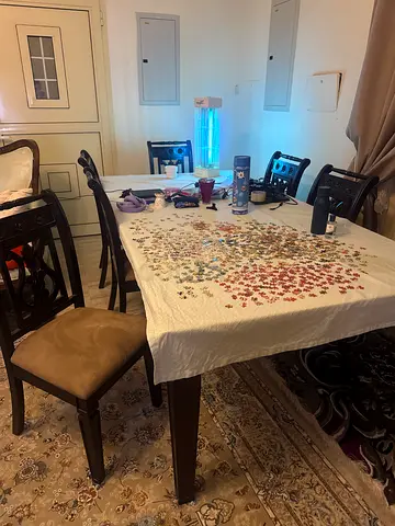 Dark brown excellent wood dinning table of 8 person with excellent condition chairs with cushions