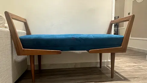 solid wood bench with blue cushion