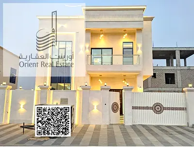 Villa for sale in Ajman, Al Helio 2 area, including registration fees, water and electricity, consisting of 6 master bedrooms, a majlis, a hall and a