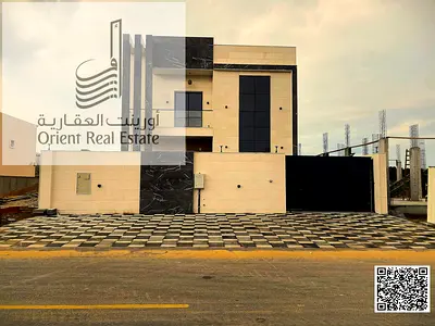 Villa for sale in Ajman, Al Zahia area, including registration and ownership fees. 4 master bedrooms with a modern kitchen and pantry, with indoor and
