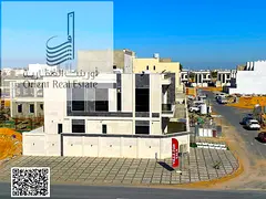 Villa for sale in Ajman, Al Helio 2 area. The villa consists of 5 master bedrooms, a majlis, 2 livin