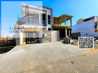 Villa for sale in Ajman, Al Helio 2 area. The villa consists of 5 master bedrooms, a majlis (formal sitting room), a living room, a maid's room, and a