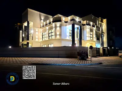 Modern corner villa with 5 bedrooms and roof. registration fees, electricity, water, and AC. in Al Helio 2, Freehold .Bank financing .