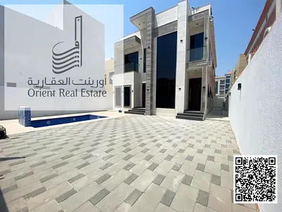 Villa for sale in Ajman, Al Rawda 2 area, second plot from Sheikh Ammar Street, including electricity, water and air conditioning, consisting of 5 mas