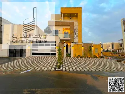 Villa for sale in Ajman, Al Helio 2 area. The villa consists of 5 master bedrooms, a majlis, 2 living rooms, a fully equipped kitchen, and a maid's ro