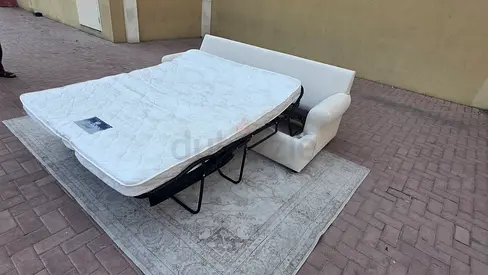 Beige 3-seat Cratebarrel sofa bed with mattress