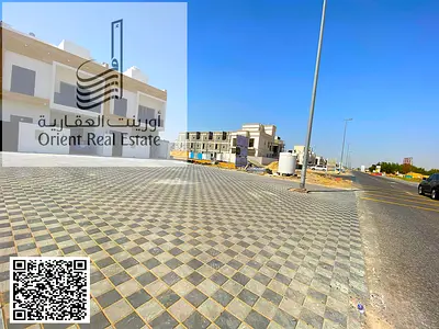 Villa for sale in Ajman, Al Helio 2 area. The villa consists of 4 master bedrooms, a majlis (formal sitting room), a living room, a maid's room, and a