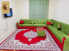 Luxury furnished apartment with two bedrooms and a living room for monthly rent in Al Rashidiya 3 