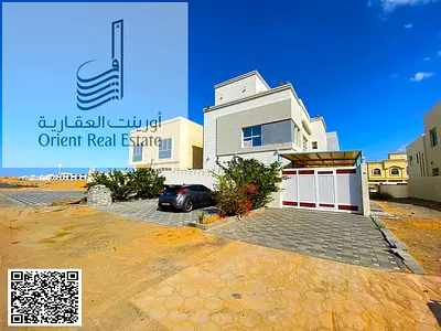 Villa for sale in Ajman, Al Yasmin area. The villa consists of 5 master bedrooms, a majlis, 2 living rooms, a maid's room, and a roof terrace. Freehol