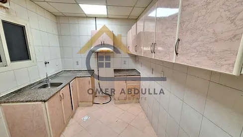 Super offer lavish 1bhk apartment with balcony and with 2 bathrooms in Muweilah area