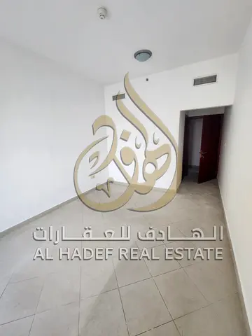 Two-bedroom master bedroom apartment with living room for rent in Al Majaz 1, Sharjah, with balcony, storage room, modern finishing and spacious areas