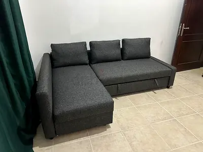 Elegant Storage Sofa Cum Bed Soft-touch grey fabric, high-density foam, and reversible layout for l