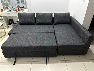 Modern Grey Sofa Bed with Storage Elegant grey finish with hidden storage compartment. Convertible d
