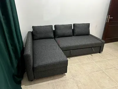 Compact Grey Sofa Bed Ideal for small spaces, offering bed conversion and storage without compromis