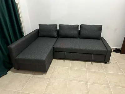 Foldable Sofa Bed with Storage Smooth folding mechanism, soft grey fabric, and large hidden storage