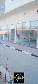 Spacious commercial shops for annual rent in Al Karama, prime location near the Corniche and Palm Tr