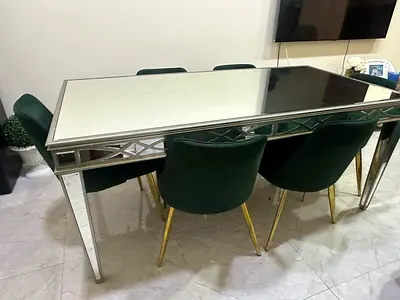 Elegant Mirror finish Dining Table with Green Velvet Chairs