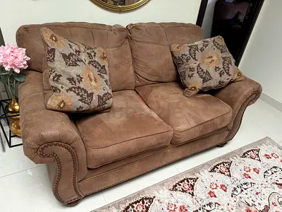Comfortable Brown Sofa with Decorative Cushions