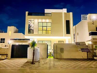 A stunning villa in Al Bahia, Ajman, located on a street and alley, offering spacious living, modern design and luxurious features including a private