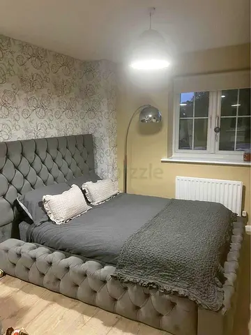 Stylish Grey Upholstered Bed with Modern Design