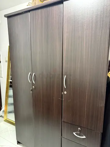 Sturdy Dark Wood Wardrobe with Multiple Compartments