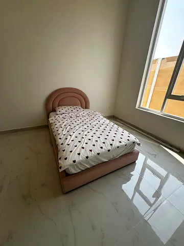 Single Bed with a Unique Headboard Design