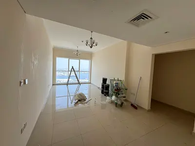 Two bedrooms and a living room - annual rent - Ajman Corniche - central air conditioning - maintenance included - free parking