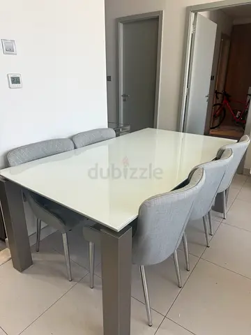 Modern Glass Dining Table with Gray Chairs