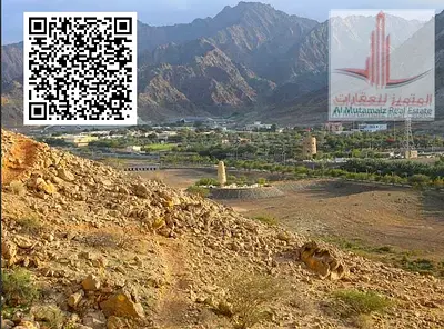 Land for sale in Masfout, Basin 8, two plots together, 3 streets and alley, area 9050 sq ft, private residential building permit