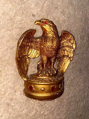 Gold falcon statue with ruby