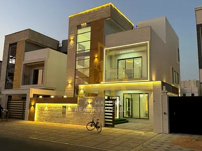 Une villa moderne bénéficiant d'un emplacement privilégié dans le prestigieux quartier d'Al Bahia à Ajman. Avec son vaste jardin en retrait, cette vil