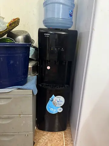 Hitachi almost brand new water dispenser with nestle bottles