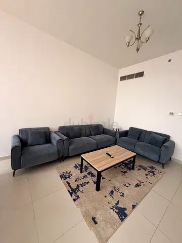 Stylish Corner Sofa with Modern Rug