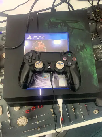 Sony PlayStation 4 Console with Controller and Game