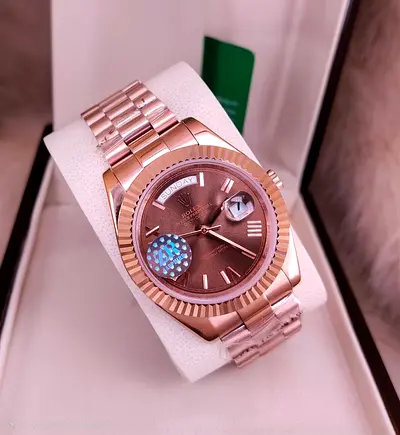 Rose Gold Rolex Watch with Date Display