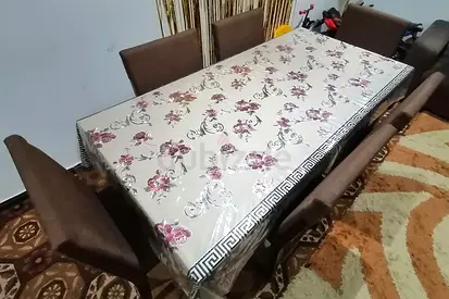 Brown Dining Table for SALE with a Floral Design Mat on top