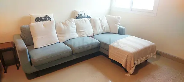 Comfortable L-Shaped Sofa with Cushions