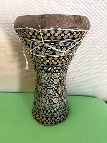 Hand drum -darbuka style. Ornate silver and black decoration.