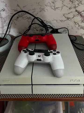 Sony PlayStation 4 Console with Two Controllers