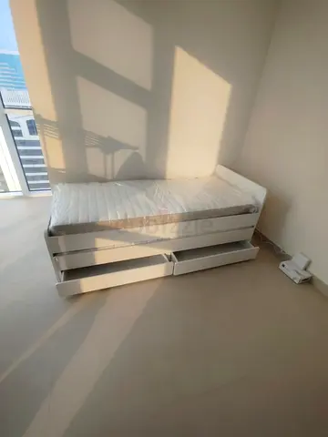 Ikea slakt bed frame with under bed and 2 storage drawers underneath with 2 Ikea mattresses
