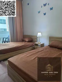Furnished 2BR apartment for yearly rent in Ajman One Towers, prime location above restaurants, near