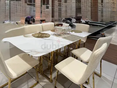 A Marble top Dinning Table with Gold Metal legs plus 6 dinning chairs