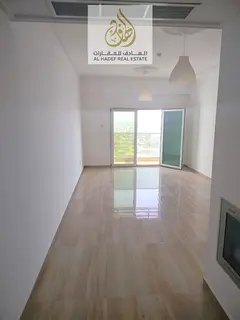 Annual rent in Ajman, Al Nuaimiya 3 area, near Dubai Islamic Bank. Two-bedroom apartment with a livi