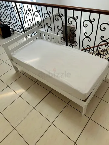 White toddler bed with top quality foam mattress barely used
