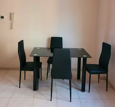 Modern Glass Dining Table with Four Chairs