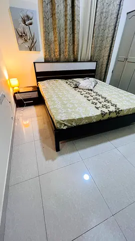 Bed frame with medicated mattress and side table