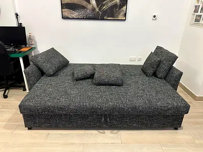 Product Type Three Seater Sofa Bed with built-in storage, designed for both seating and sleeping pur