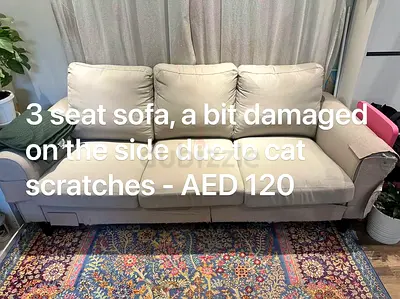 Beige 3-seater sofa — used, some cat scratches (AED 120)