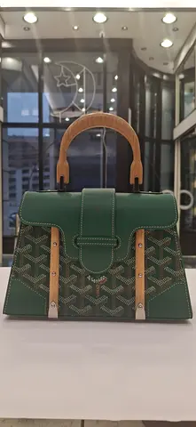 Green patterned tote bag with wooden handles
